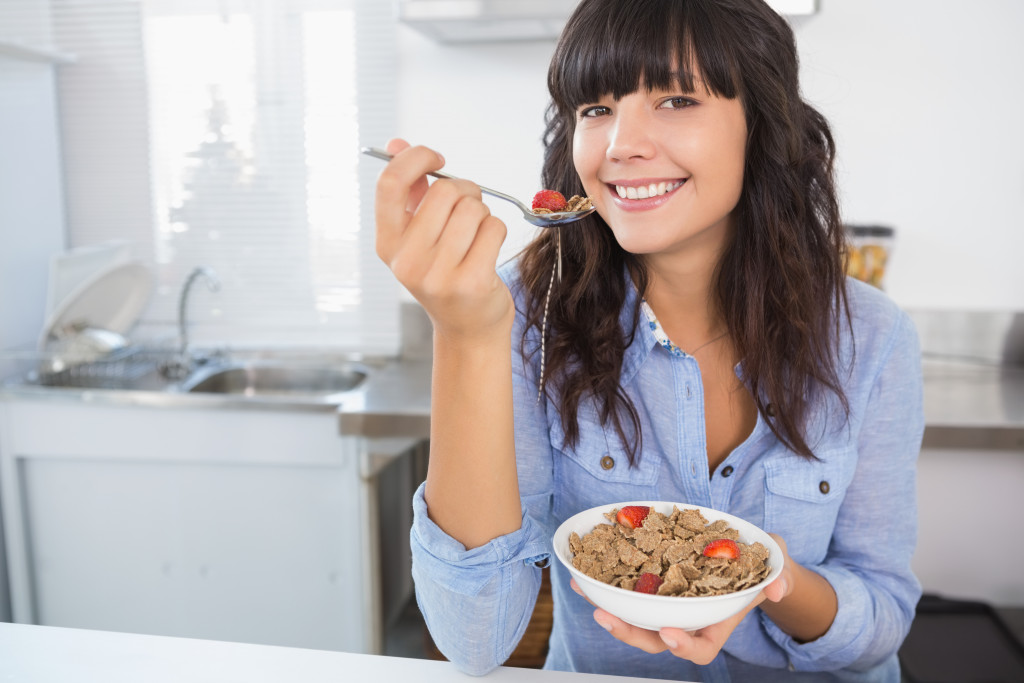 A woman eating a healthy breakfast